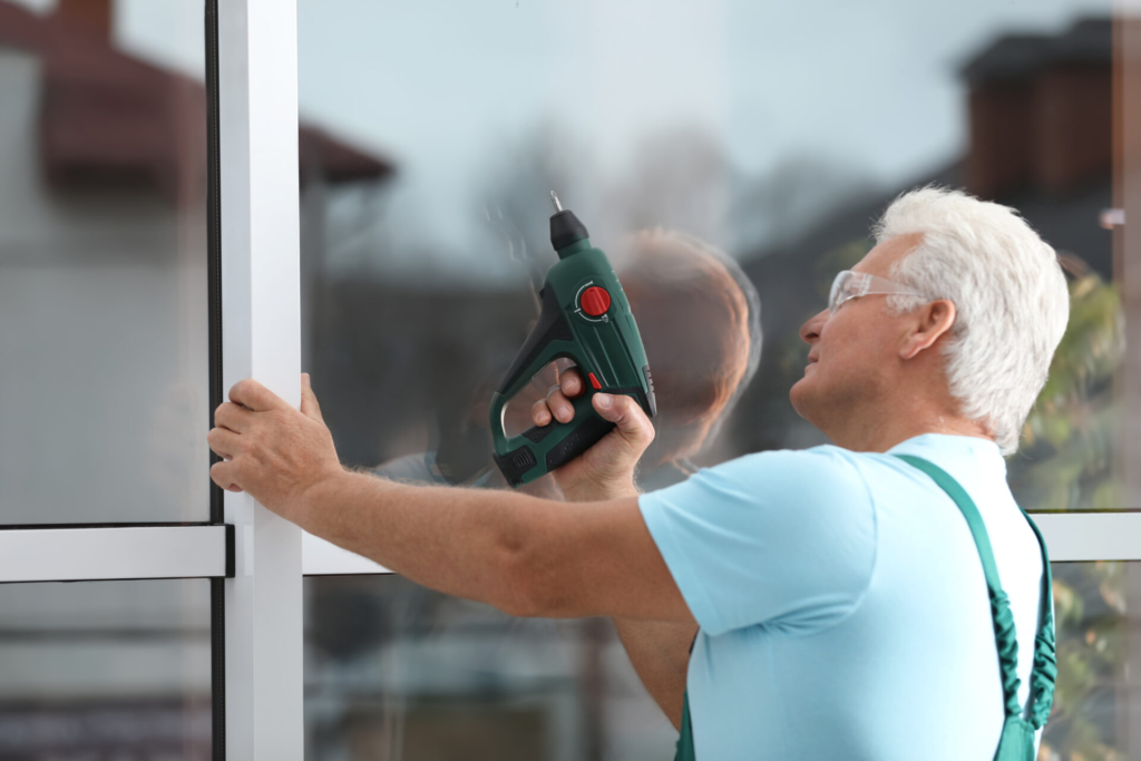 Man installing Insulated Glass