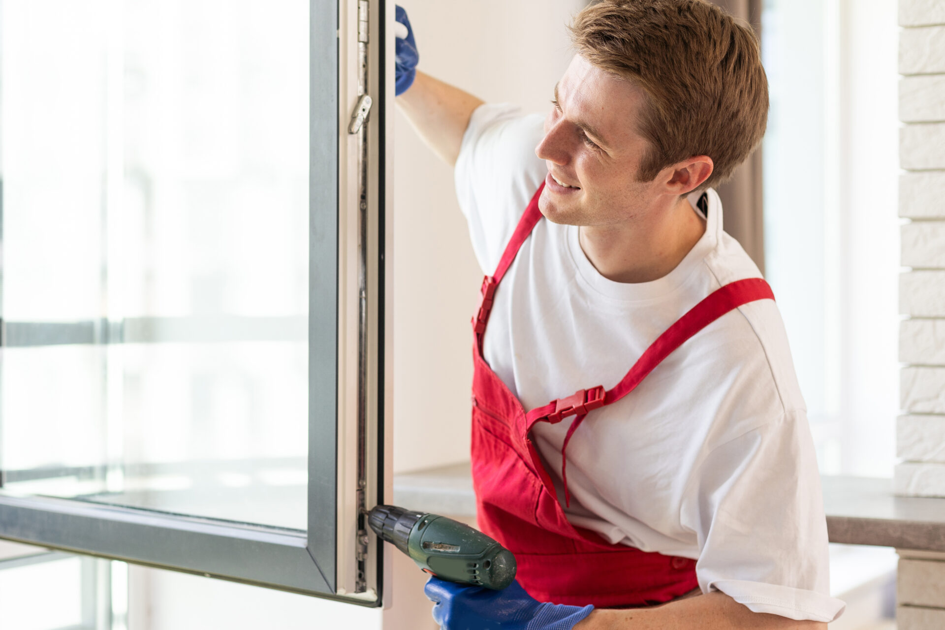 Man installing Insulated Glass