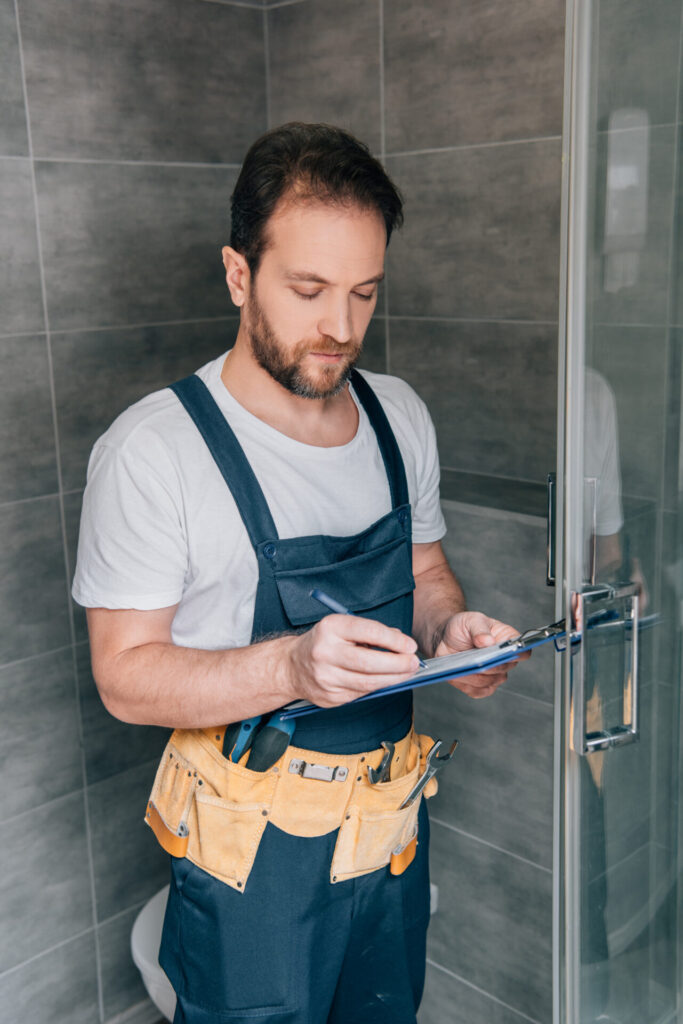 Man working in a New Shower Door Installation