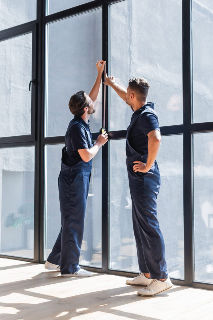 Men installing glass window
